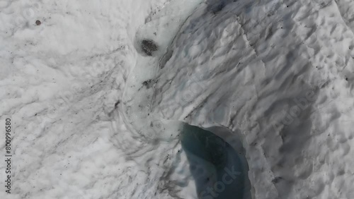 Caucasus, North Ossetia, Genaldon Gorge. Cracks on the surface of the glacier. photo