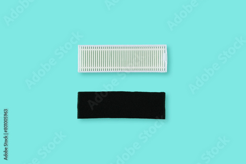Hepa filter and carbon filter for robot vacuum cleaner. Green background.
