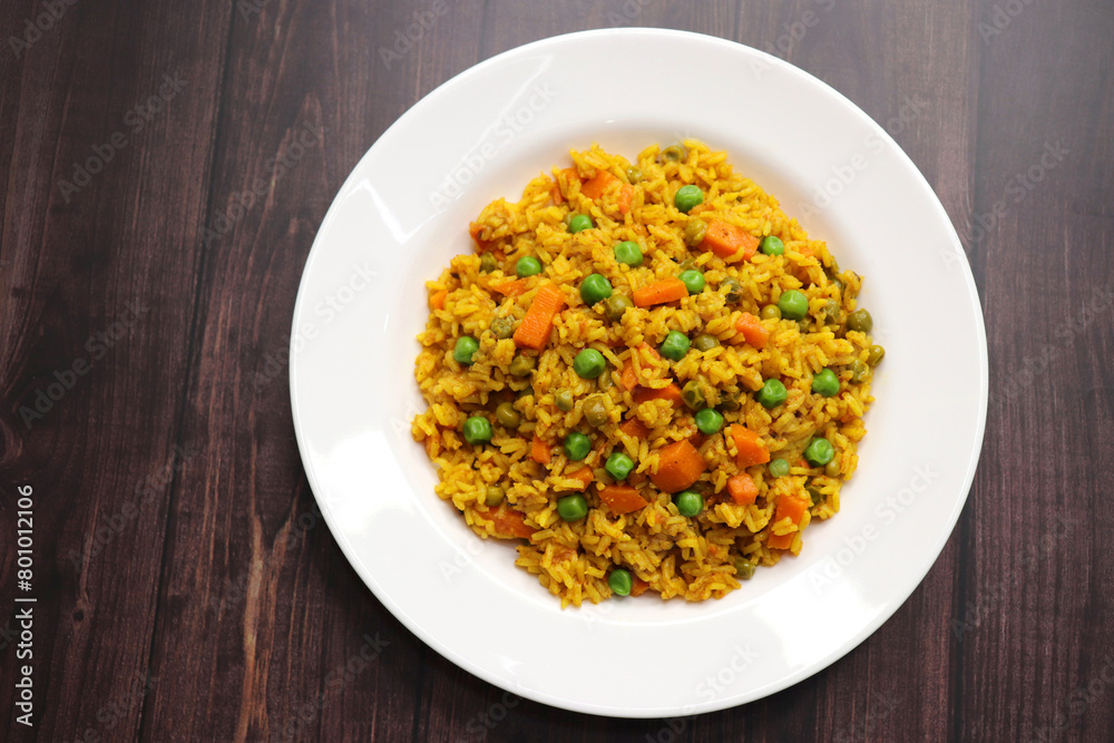 Carrots and Peas Pilaf or Gajar Matar Pulao. It is a one pot rice dish made with Basmati Rice and Vegetables, seasoned with spices, Served with yogurt raita or curd. Healthy weight loss meal. copy Carrots and Peas Pilaf or Gajar Matar Pulao. It is a one pot rice dish made with Basmati Rice and Vegetables, seasoned with spices, Served with yogurt raita or curd. Healthy weight loss meal. copy