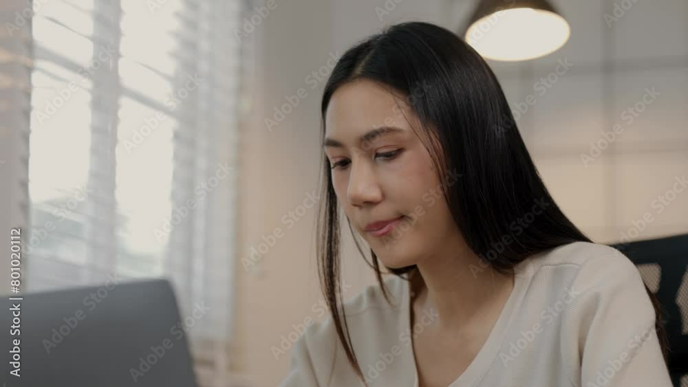 A beautiful Asian female entrepreneur is eating an instant noodles while working, she is consuming instant food in a hurry because of the deadline is coming, hungry but had to finish work in time A beautiful Asian female entrepreneur is eating an instant noodles while working, she is consuming instant food in a hurry because of the deadline is coming, hungry but had to finish work in time