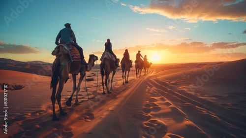 Bedouins on camels travel through the desert