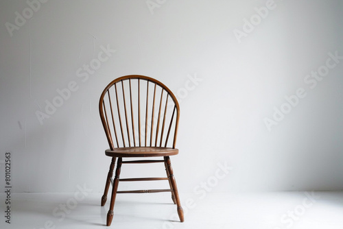 Vintage Windsor chair positioned against a clean white backdrop.