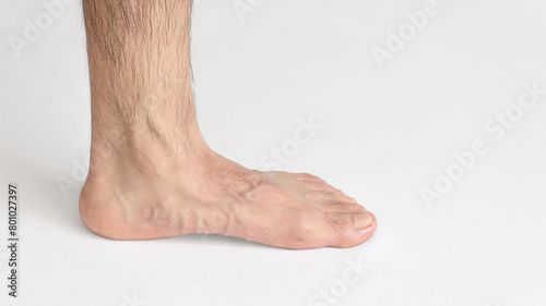 Inner view of adult man's ankle, against a white background with space for text, left foot, full foot