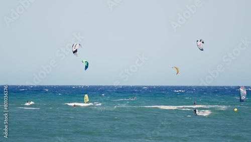Group of people wind surfing in the ocean