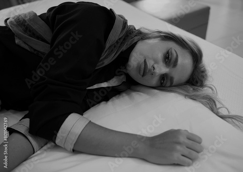 Beautiful woman at bed in black and white