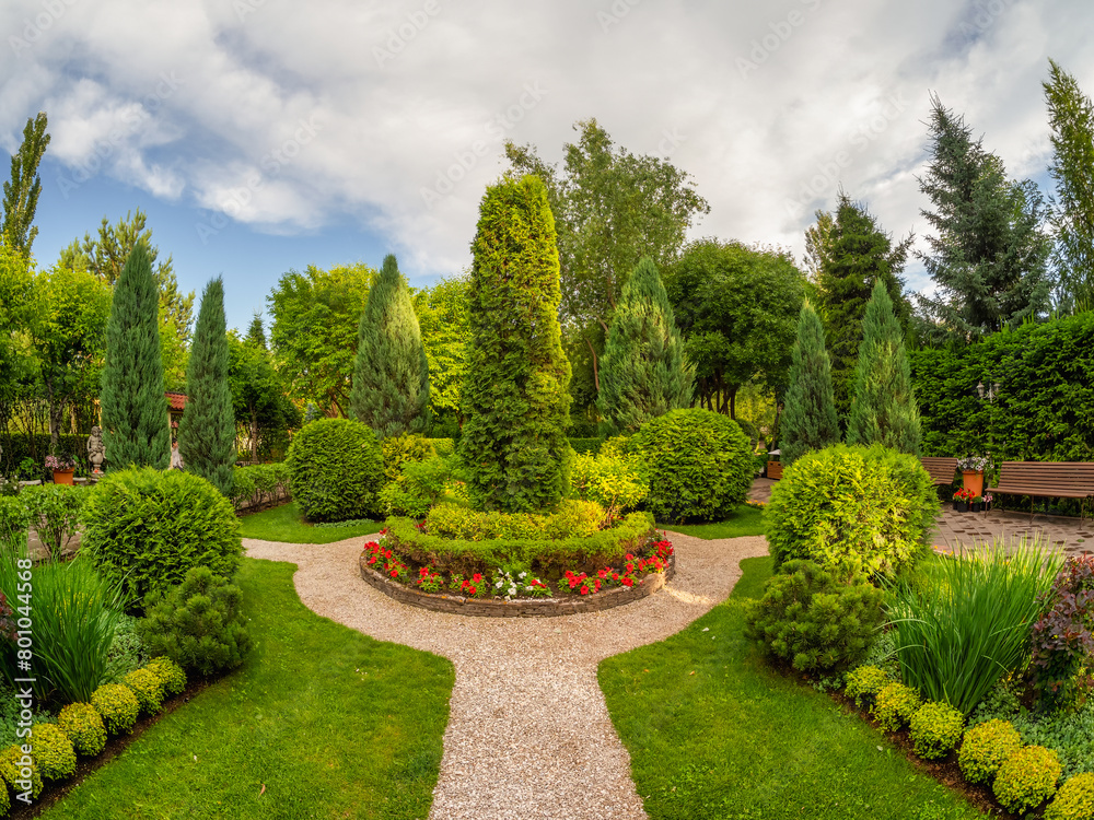 Summer garden courtyard. Bush lined path in park. Summer garden courtyard. Bush lined path in park.