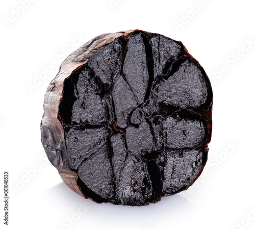 Half bulb of black garlic isolated on white background. With clipping path.