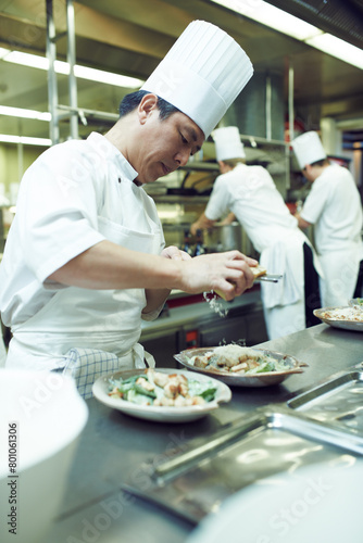 Asian man  chef and plate with food in kitchen for restaurant  service and hospitality in Thailand. Male cook  gourmet meal and nutrition for fine dining  wellness and catering for hotel in Bangkok