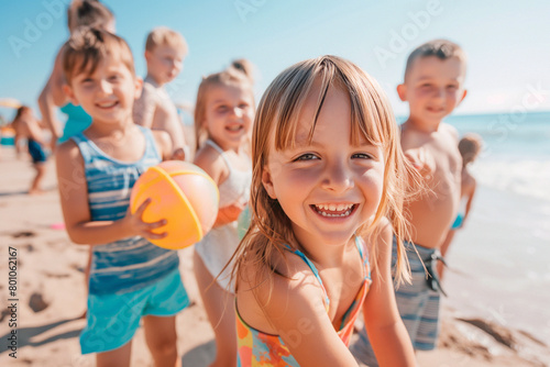 Little girl on the summer beach. Group of Happy kids playing at the seaside