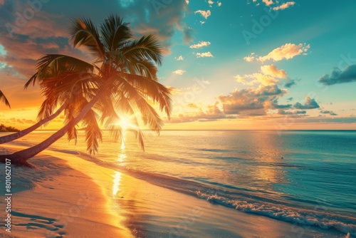 Sunset on the beach with palm trees and golden sand © wanna