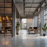 A large open office space with a lot of natural light and greenery