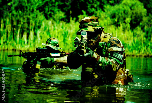 Soldiers move in the heart of a marsh, crossing swampy waters, tropical jungle heat, extreme conditions of concealed tactical combat operations of special task forces