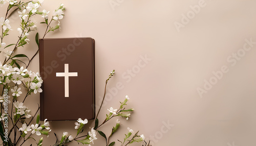 Holy Bible, cross and flowers on light background with space for text photo