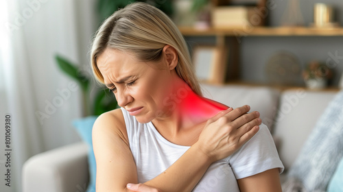 caucassian woman suffering from cervical pain or neck pain at home - muscle aches and joint pain concept