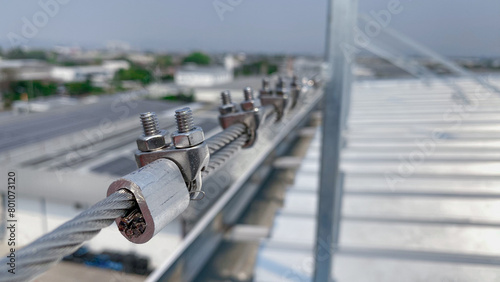 the fastening of stainless steel wire ropes with safely locking U-bolts.   photo