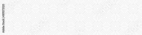Seamless trend ornament of circles and arcs  geometric white shapes for textiles and wallpaper. Abstract panoramic pattern on a gray background for a New Year or wedding cover or card.
