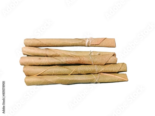 Bidi or Beedi, A beedi is a thin cigarette or mini-cigar filled with tobacco flake and commonly wrapped in a tendu or Piliostigma racemosum leaf tied with a string or adhesive, bidi isolated  photo