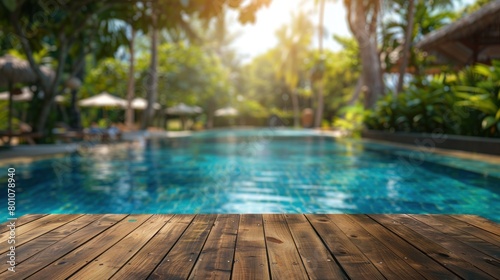 Empty wood table top swimming pool in tropical resort in summer - can used for display or montage your products. banner for design