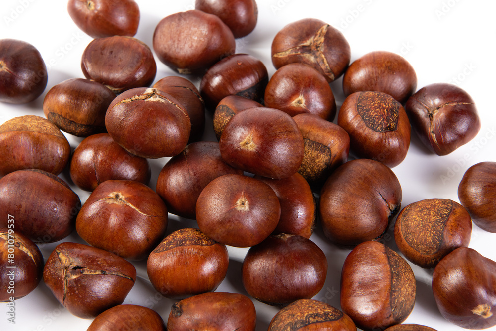 closeup of roasted chestnut on white background. closeup of roasted chestnut on white background.