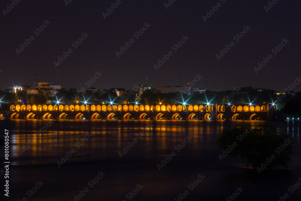 the beautiful view of the city of Isfahan and the zayandeh rud River at night and the thirty-three bridge (siose pol) of this city, which have a special view at night with lighting