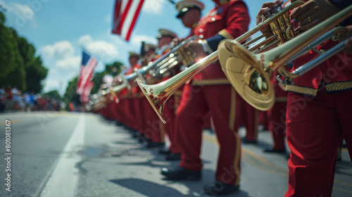 Marching band with golden trumpets in parade, vibrant red uniforms, American flags photo
