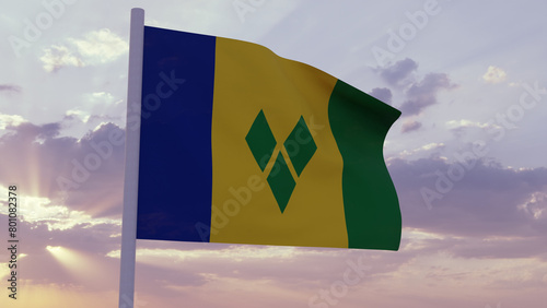 Flag of Saint Vincent and the Grenadines in the wind on a sunset sky photo