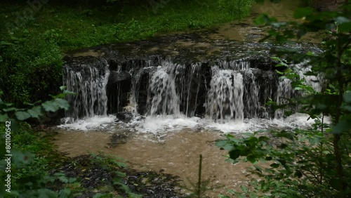 View of the Jeleń waterfall between tree branches