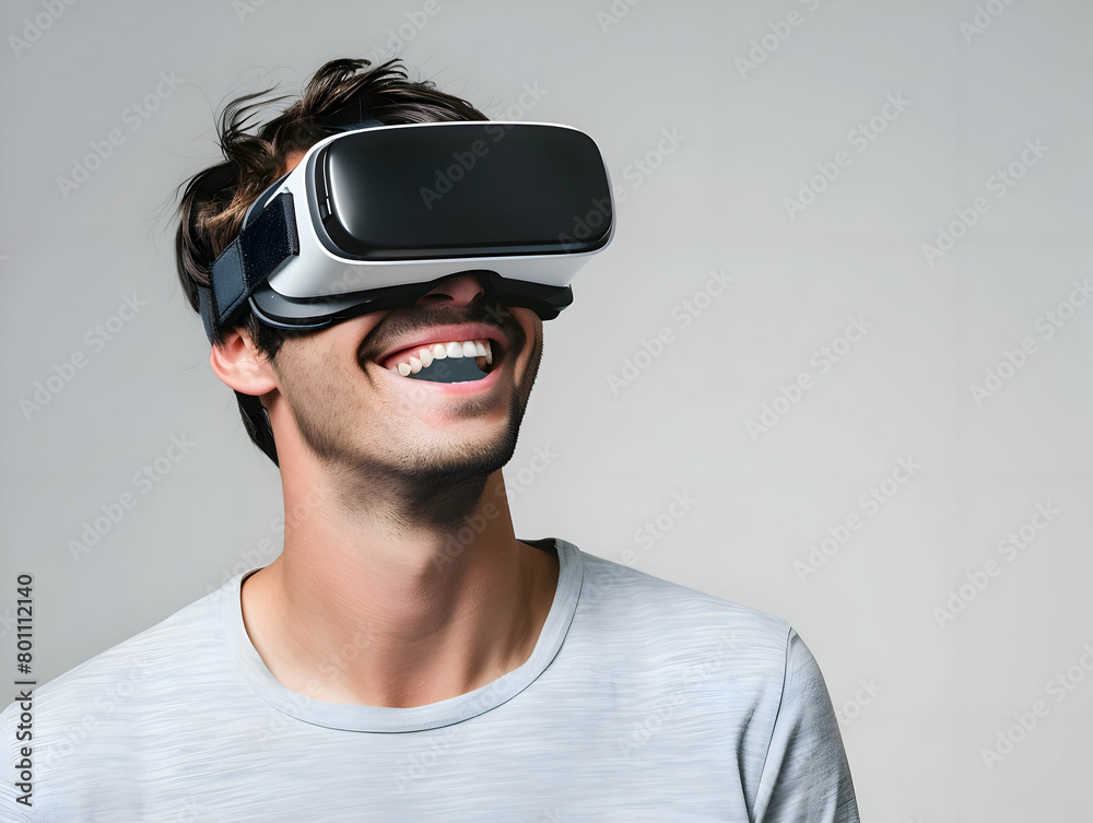 Portrait of happy young man wearing white augmented virtual reality glasses on whitte color studio background with copy space