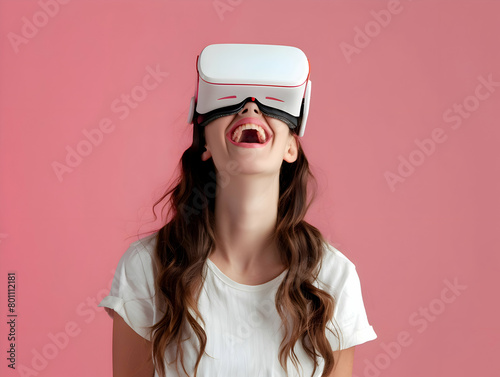 Portrait of happy young brunette woman wearing white augmented virtual reality glasses on pink color studio background with copy space © Annemarie