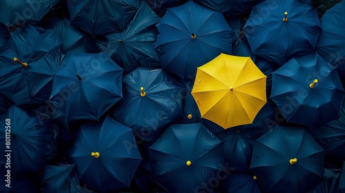 aerial view, dark blue umbrellas, just one in yellow, concept: Uniqueness, copy and text space, 16:9 