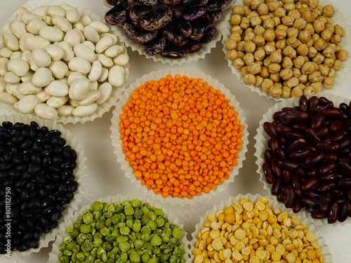 Various sorts of legumes that are used as a dry grain for human consumption, colorful natural texture background.