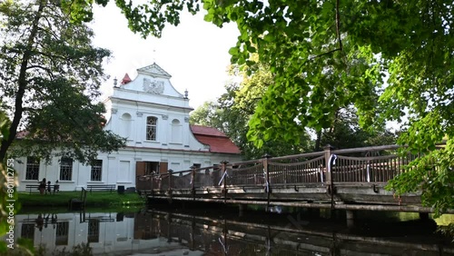 Church on the water in Zwierzyniec in the summer between the trees