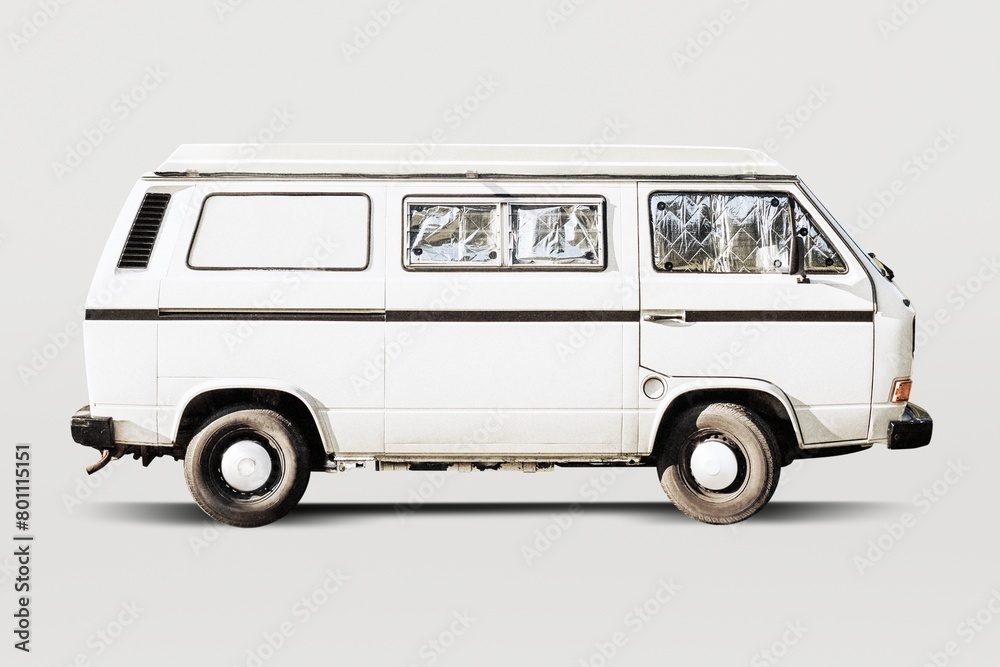 Old white campervan with blocked out windows