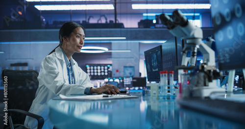 Hospital Research Center Laboratory: Asian Female Medical Scientist Using Computer with Brain MRI Images. Professional Neurologist Analysing CT Scan, Finding Treatment for Patient With Brain Damage.