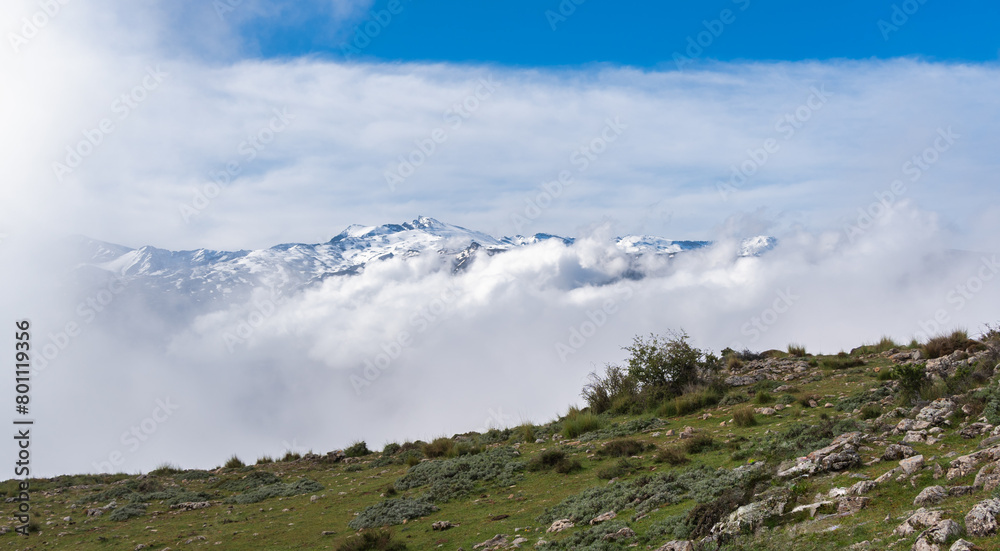 Sierra Nevada's Peaks Veiled by Clouds