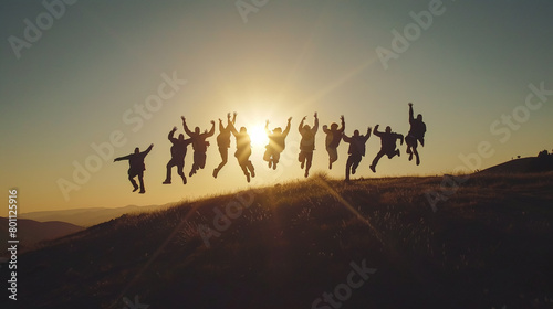 people jumping on the beach at sunset