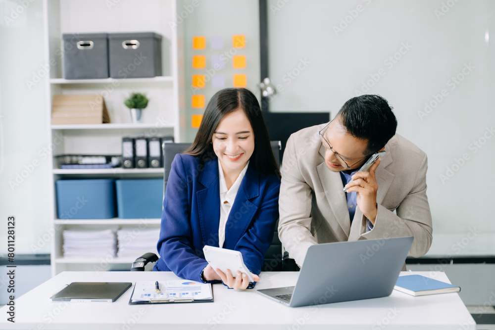 Portrait of success business people working together in home office. Couple teamwork startup concept. Portrait of success business people working together in home office. Couple teamwork startup concept.