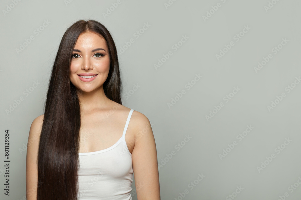Brunette model woman with natural make-up, healthy skin and long hair. Female beauty, cosmetology and skincare concept Brunette model woman with natural make-up, healthy skin and long hair. Female beauty, cosmetology and skincare concept