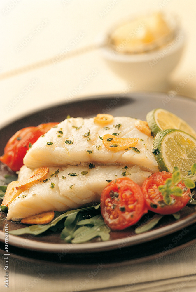 Two fresh cod fillets cooked in garlic Two fresh cod fillets cooked in garlic
