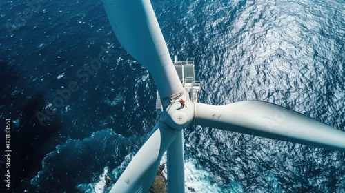Workers on windmill in ocean environmental concept wind energy