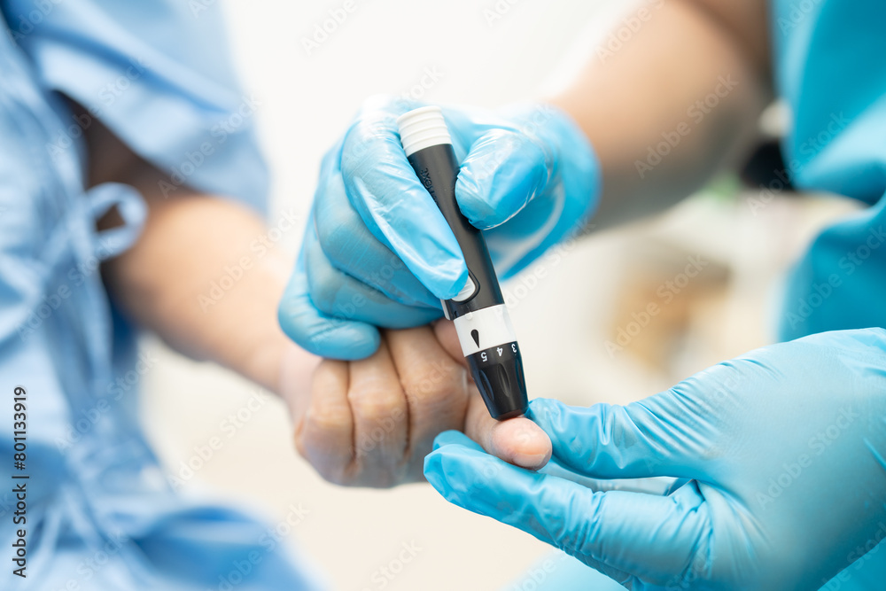 Doctor check diabetes from finger blood sugar level with finger lancet. Doctor check diabetes from finger blood sugar level with finger lancet.