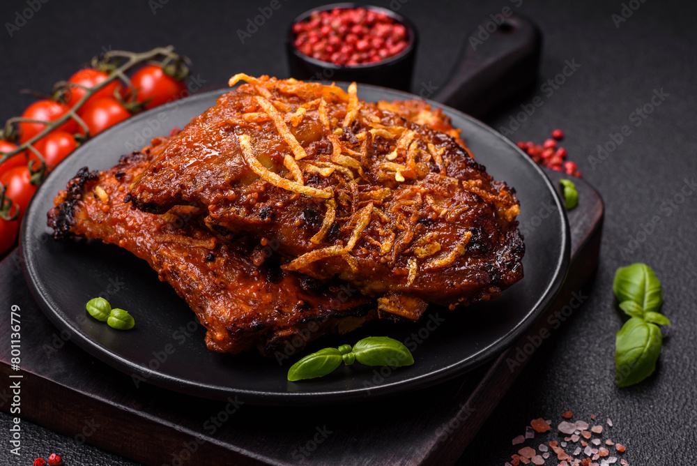 Delicious pork or beef ribs baked on the grill with salt, spices and herbs Delicious pork or beef ribs baked on the grill with salt, spices and herbs