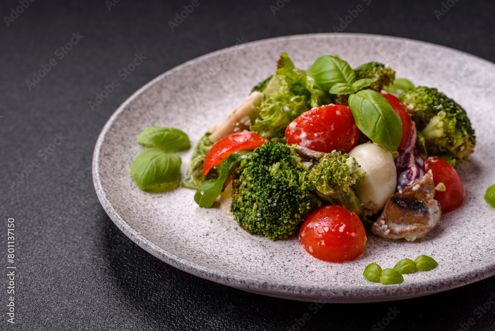 Delicious fresh juicy salad with quail eggs, cherry tomatoes, lettuce leaves