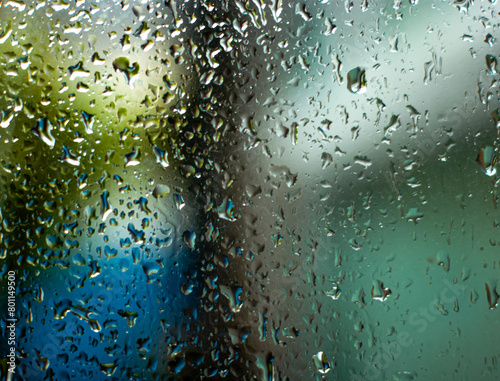 water drops on glass the melancholy mood of a rainy day. with raindrops on a window. Abstract 