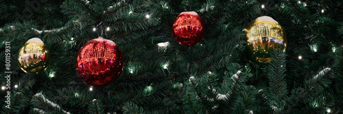 Festive New Year Christmas tree decorated red yellow Christmas balls with garlands lights, close up view, merry Christmas and happy New Year, essence of holiday cheer and joyous spirit