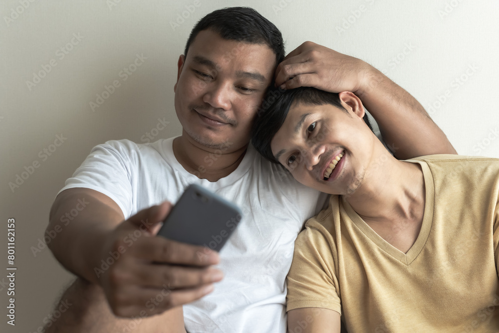 Asian gay couples spending time happy together, intimate relationship and pride month concept Asian gay couples spending time happy together, intimate relationship and pride month concept