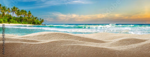 Serene Beach Landscape with Waves Gently Caressing the Shoreline. Pristine sands meet the azure waters under a tranquil tropical sky. Panorama with copy space.