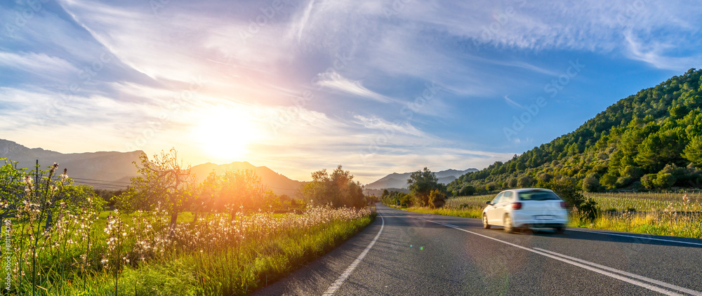 rental car in spain mountain landscape road at sunset