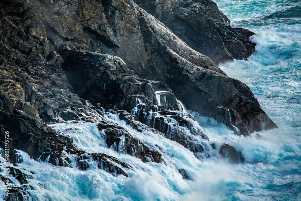 Cliffs with big waves breaking at the coast.