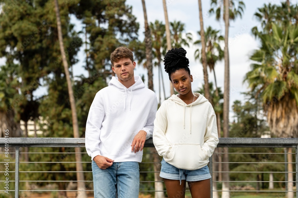 Couple in casual wear apparel, chilling in a park Couple in casual wear apparel, chilling in a park